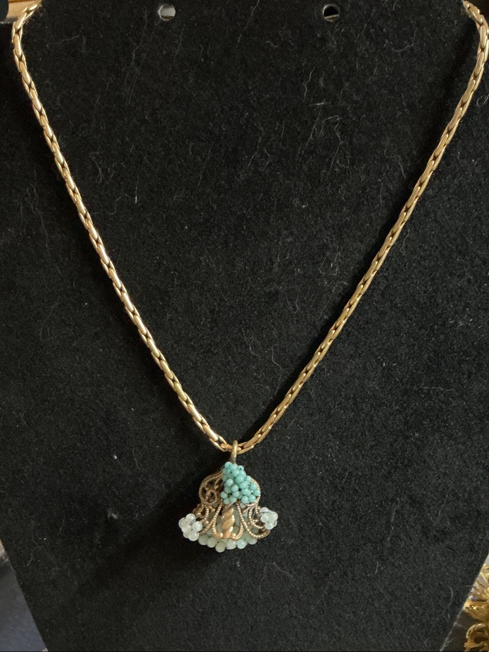 Vintage necklace with brass and filigree pendant